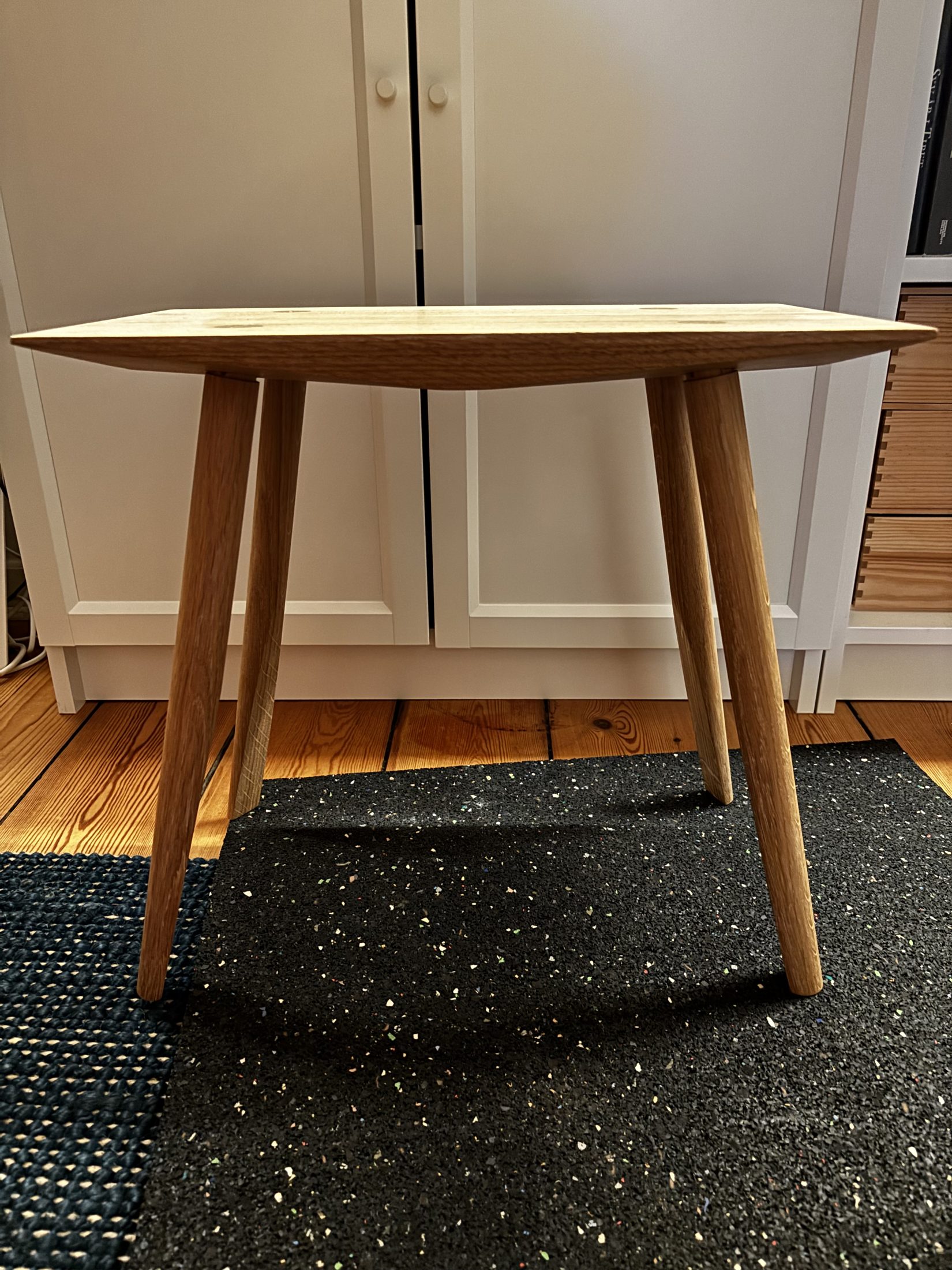 The 252 stool in oak, seen straight on
