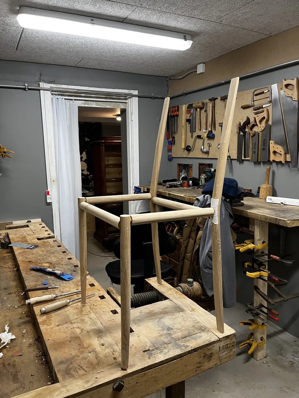 The bare oak frame on a workbench
