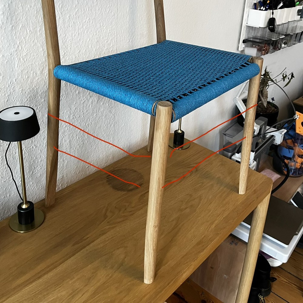 The chair with possible stretcher positions marked in red cord