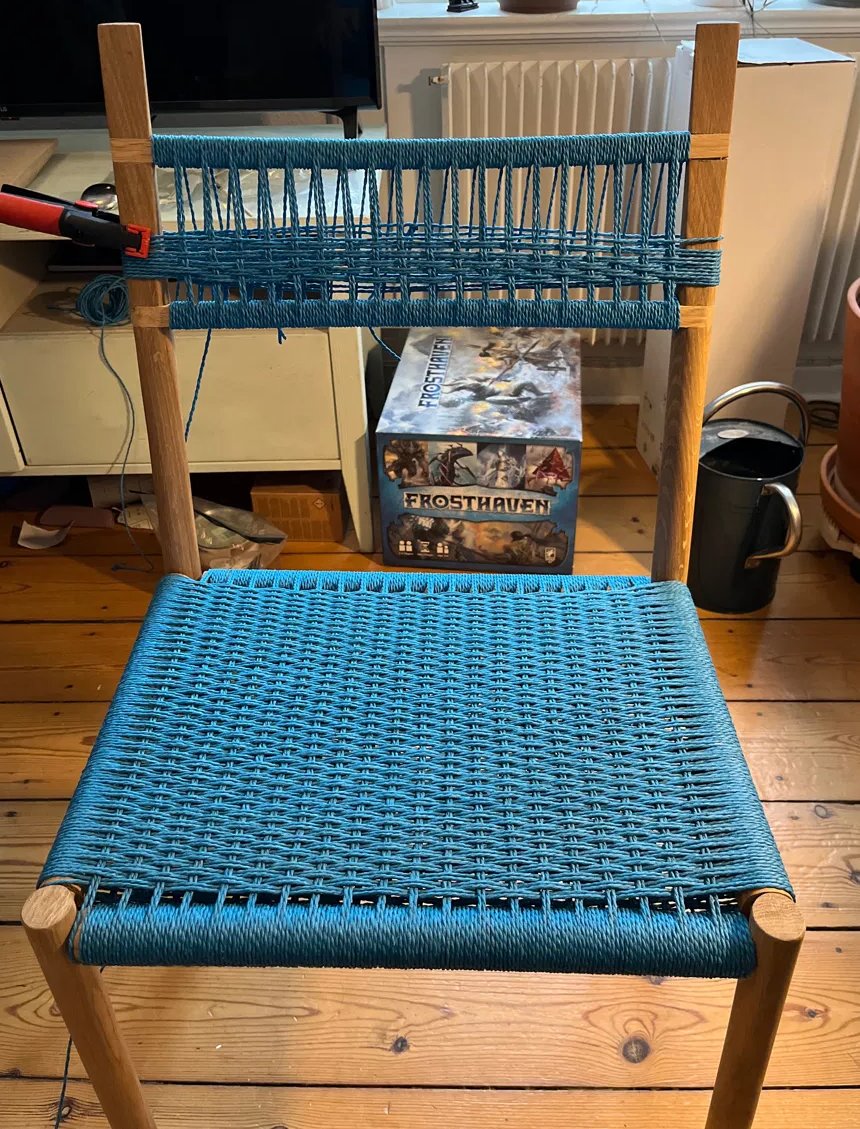 The back of the chair part way through weaving